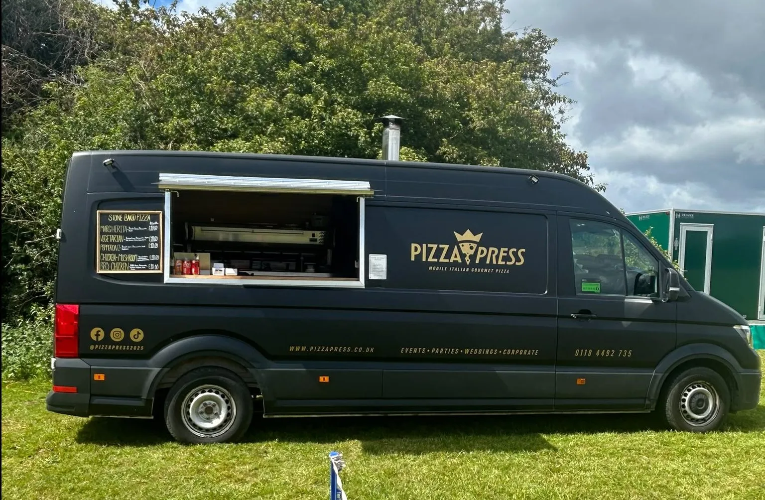 Pizza Press van serving guests at an outdoor event